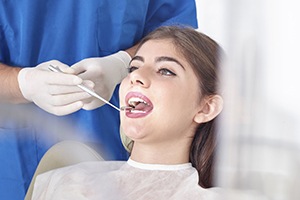 Woman receiving an oral cancer screening