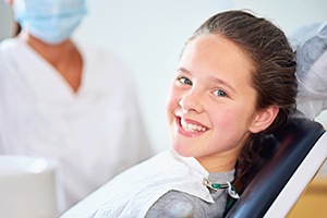 Young girl sharing healthy smile after fluoride treatment