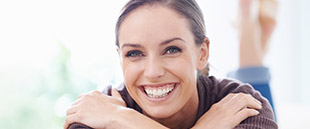 Woman sharing healthy smile after periodontal therapy