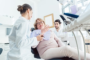 Patient talking to smiling patient during exam